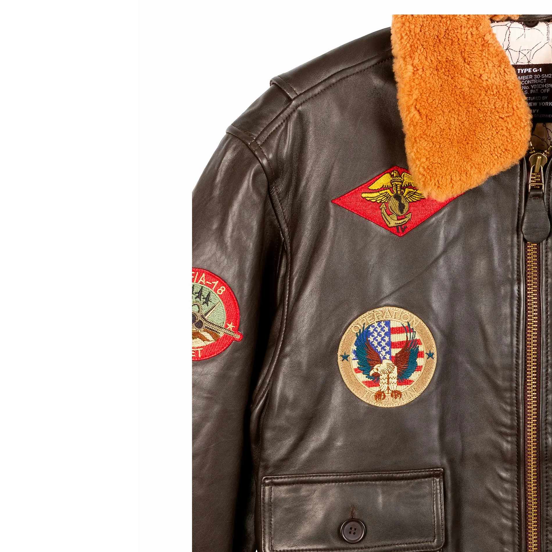 top gun signature series round and red shaped patch on right chest